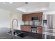 Modern kitchen features stainless steel appliances and granite countertops at 10801 N 45Th St, Phoenix, AZ 85028