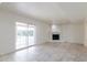 Living area with fireplace and access to backyard patio at 10801 N 45Th St, Phoenix, AZ 85028