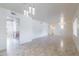 Open living space with tile floors and kitchen access at 10801 N 45Th St, Phoenix, AZ 85028