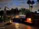 Night view of outdoor kitchen with fireplace and grill at 10801 N 45Th St, Phoenix, AZ 85028