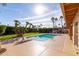 Relaxing pool and grassy backyard with palm trees at 10801 N 45Th St, Phoenix, AZ 85028