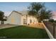 Home exterior view with a grassy backyard and brick patio at 11549 E Bella Vista Dr, Scottsdale, AZ 85259