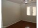 Bright bedroom featuring wood-look floors and a window at 12440 N 20Th St # 111, Phoenix, AZ 85022