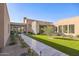 Landscaped courtyard with walkway and lush greenery at 12659 E Shadow Ridge Dr, Scottsdale, AZ 85255