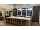 Modern kitchen featuring a large island, sleek cabinetry, and pendant lighting at 12659 E Shadow Ridge Dr, Scottsdale, AZ 85255