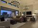 Spacious living room with a fireplace and large sliding doors leading to the patio at 12659 E Shadow Ridge Dr, Scottsdale, AZ 85255