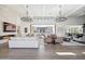 Open concept living area with hardwood floors, fireplace, and large windows at 12659 E Shadow Ridge Dr, Scottsdale, AZ 85255
