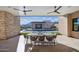 Outdoor patio with seating area, mountain views, and access to the pool at 12659 E Shadow Ridge Dr, Scottsdale, AZ 85255