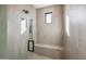 Elegant shower with built-in bench and frameless glass enclosure at 12659 E Shadow Ridge Dr, Scottsdale, AZ 85255