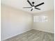 Spacious bedroom featuring tile floors and a ceiling fan at 1331 W Baseline Rd # 122, Mesa, AZ 85202