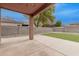 Covered patio with artificial turf and block wall at 1343 E Walnut Rd, Gilbert, AZ 85298