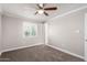 Bedroom with ceiling fan, carpet, and window at 13837 N 38Th St, Phoenix, AZ 85032