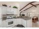 Kitchen with granite counters, white cabinets, and open layout at 15201 W Verde Ln, Goodyear, AZ 85395