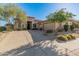 Single-story home with desert landscaping, two-car garage, and a large driveway at 15637 E Cactus Dr, Fountain Hills, AZ 85268