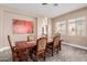 Bright dining room with a large wooden table and six chairs at 20295 E Camina Plata --, Queen Creek, AZ 85142