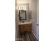 Clean bathroom with single sink vanity, shower, and updated flooring at 2400 E Baseline Ave # 144, Apache Junction, AZ 85119