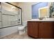 Clean bathroom, shower/tub combo and wood vanity at 26053 W Tonopah Dr, Buckeye, AZ 85396