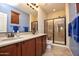 Double vanity bathroom with a large walk in shower at 26053 W Tonopah Dr, Buckeye, AZ 85396