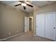 Well-lit bedroom with double door closet and carpet at 26053 W Tonopah Dr, Buckeye, AZ 85396
