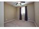 Spacious bedroom with ceiling fan and carpeted floor at 26053 W Tonopah Dr, Buckeye, AZ 85396