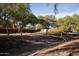 Landscaped walking path with mature trees at 26053 W Tonopah Dr, Buckeye, AZ 85396