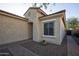 Side view of the house, showing a window and walkway at 26053 W Tonopah Dr, Buckeye, AZ 85396