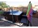 Clean hot tub with steps and a cover at 26053 W Tonopah Dr, Buckeye, AZ 85396