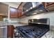 Stainless steel gas cooktop and built-in microwave at 26053 W Tonopah Dr, Buckeye, AZ 85396
