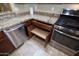 Kitchen with pull-out drawers and corner cabinet storage at 26053 W Tonopah Dr, Buckeye, AZ 85396