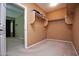 Bright walk-in closet with shelving and hanging space at 26053 W Tonopah Dr, Buckeye, AZ 85396