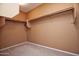 Large walk-in closet with ample shelving and hanging space at 26053 W Tonopah Dr, Buckeye, AZ 85396
