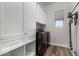 Laundry room with washer, dryer, and storage cabinets at 26183 W Rosemonte Dr, Buckeye, AZ 85396