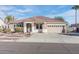 Single-story home with a two-car garage and desert landscaping at 27041 N 31St Dr, Phoenix, AZ 85083