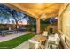 Covered patio with seating area, artificial turf, and outdoor kitchen at 2927 W Sousa Dr, Anthem, AZ 85086