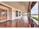 Front entrance with a wooden door and tile flooring at 31218 N 49Th St, Cave Creek, AZ 85331