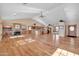 Open living room with hardwood floors, brick fireplace and kitchen at 31218 N 49Th St, Cave Creek, AZ 85331