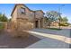 Two-story house with a front yard, driveway, and attached garage at 3323 E Rochelle St, Mesa, AZ 85213