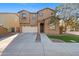 Two-story house with stone accents and a two-car garage at 3323 E Rochelle St, Mesa, AZ 85213