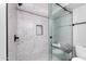 Modern shower with glass enclosure and stone tile at 3501 N 64Th St # 24, Scottsdale, AZ 85251