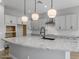 Large kitchen island with granite countertop and modern pendant lighting at 4257 E John St, Gilbert, AZ 85295