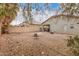 Large backyard with gravel, fire pit, and patio at 44812 W Portabello Rd, Maricopa, AZ 85139