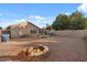 Large backyard with fire pit, patio, and gravel landscaping at 645 E Gary Dr, Chandler, AZ 85225