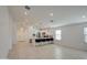 Modern kitchen with white cabinets and breakfast bar at 9612 W Trumbull Rd, Tolleson, AZ 85353