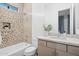 Updated bathroom with a tub, shower, and mosaic tile at 16064 E Ridgestone Dr, Fountain Hills, AZ 85268