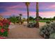 Landscaped yard with desert plants and a golf course view at 19814 N Shadow Mountain Dr, Surprise, AZ 85374