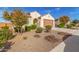 One-story house with desert landscaping, two-car garage, and neutral color scheme at 25920 W Tina Ln, Buckeye, AZ 85396