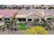 Single-story home with backyard patio and putting green at 26822 W Oraibi Dr, Buckeye, AZ 85396