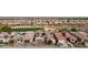 Aerial view of a community with golf course and solar-paneled homes at 26822 W Oraibi Dr, Buckeye, AZ 85396