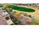 Single-story home with backyard and putting green at 26822 W Oraibi Dr, Buckeye, AZ 85396