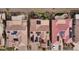 Three homes with solar panels and tile roofs, viewed from above at 26822 W Oraibi Dr, Buckeye, AZ 85396